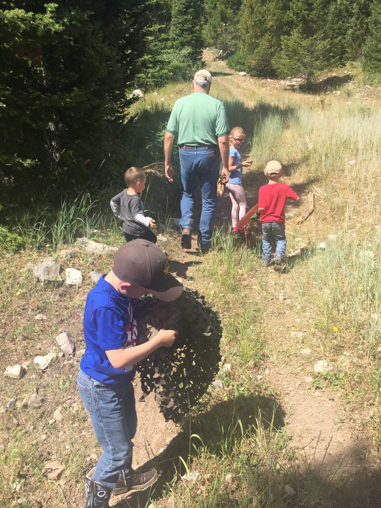 Outfitter, Sy Gilliland taking the grandkids for a hike. Staying fit for hunting season is imperative. 